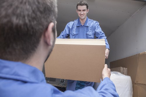 Removal van and moving team handling a residential move in Enfield