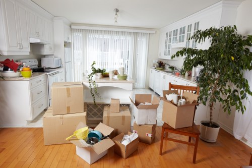 Carrying boxed household items during a home move in Enfield