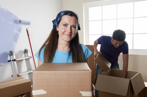 Movers handling desks and equipment during an Enfield office move