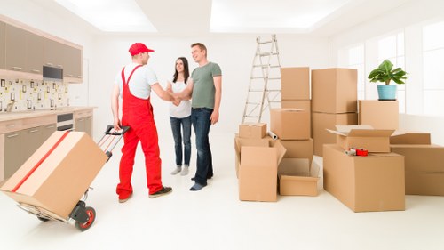 Packed office boxes and furniture ready for relocation in Enfield