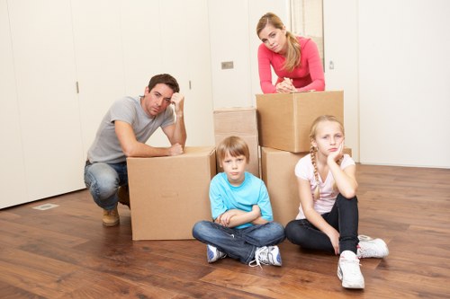 Careful loading of boxes and household items by a local team