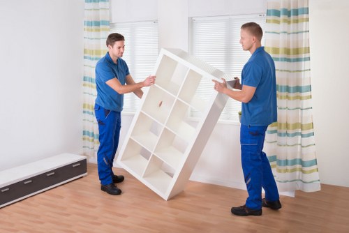 Local moving crew handling boxes and furniture